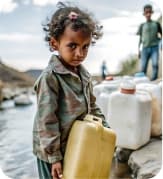 Child receiving water aid